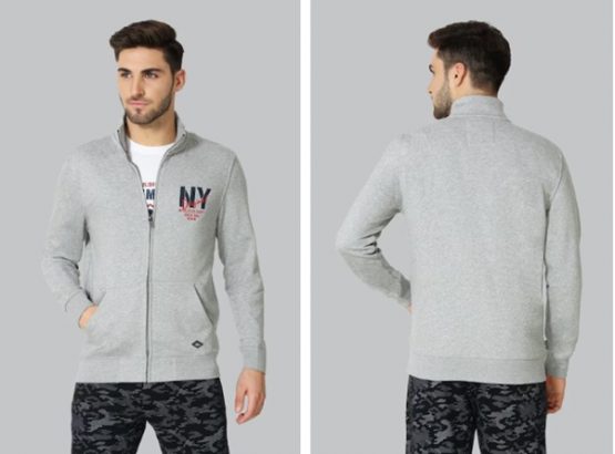 A man modeling a gray zip-up hoodie and black camo pants, shown from the front and back.