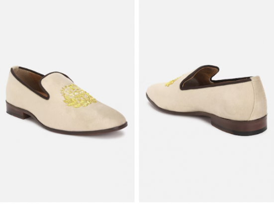 A pair of beige embroidered slip-on dress shoes displayed from the front and side angles.
