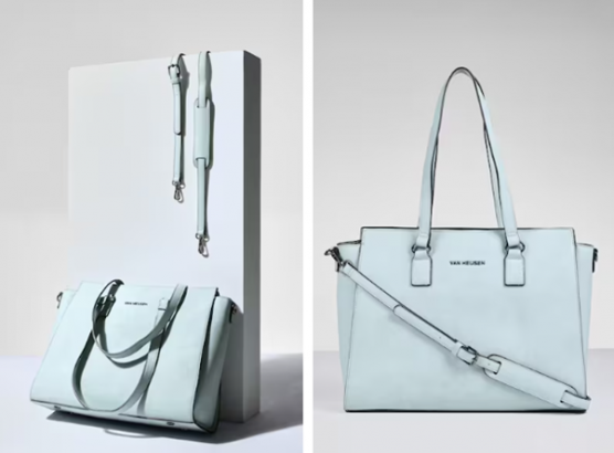 Two light blue handbags displayed against a white backdrop, one with a detachable shoulder strap.