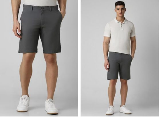 Two men modeling gray shorts and white shoes, one wearing a white polo shirt.