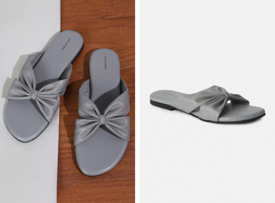 A pair of gray slides with decorative bows on a two-tone background.