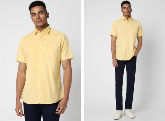 Man in a yellow shirt and dark pants with white sneakers.