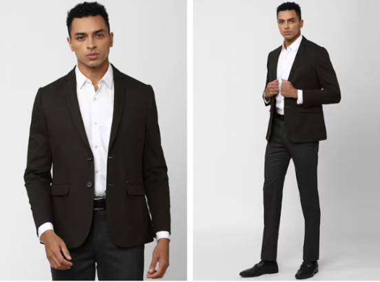 a man in a black suit and white shirt