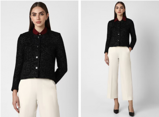 a woman in a black jacket and white pants