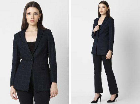 a woman in a black suit and black pants