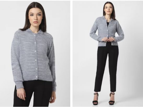 a woman in a gray cardigan and black pants