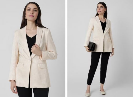 a woman in a white blazer and black pants
