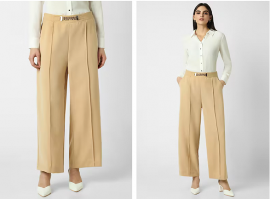a woman in a white shirt and tan pants