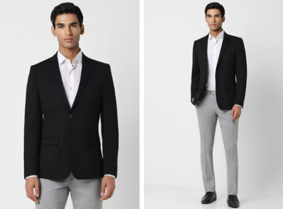 a man in a black jacket and gray pants