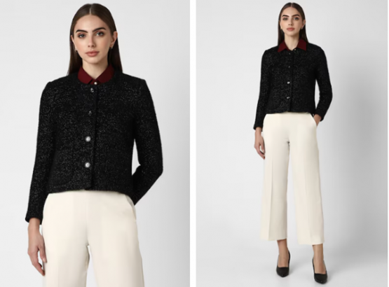 a woman in a black jacket and white pants