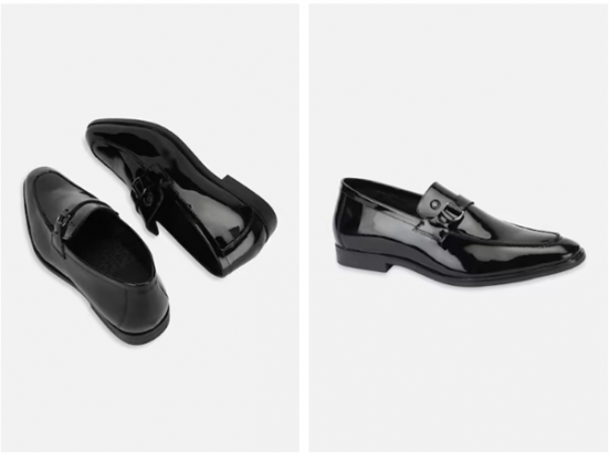 A pair of black patent leather dress shoes, one lying flat and one standing upright.
