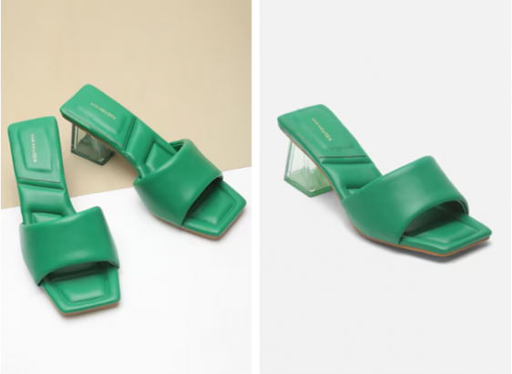 a pair of green heels sitting on top of a table