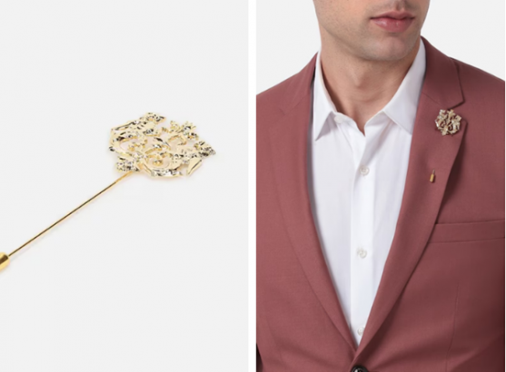 a close up of a person wearing a suit and a lapel pin