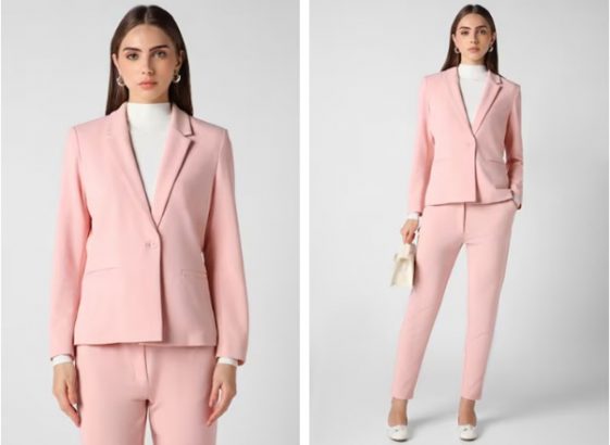 a woman in a pink blazer and white shirt