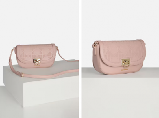 a pink purse sitting on top of a white counter