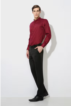 a man in a red shirt and black pants