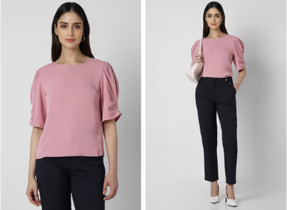 Front and side views of a model in a pink blouse and black trousers with white shoes.