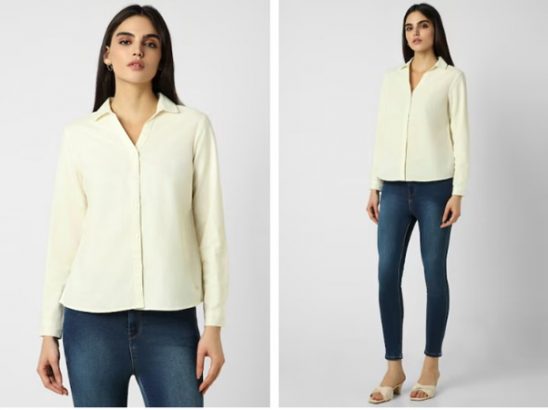 a woman wearing a white shirt and jeans