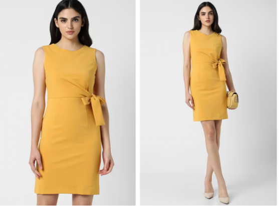 a woman wearing a yellow dress with a bow at the waist
